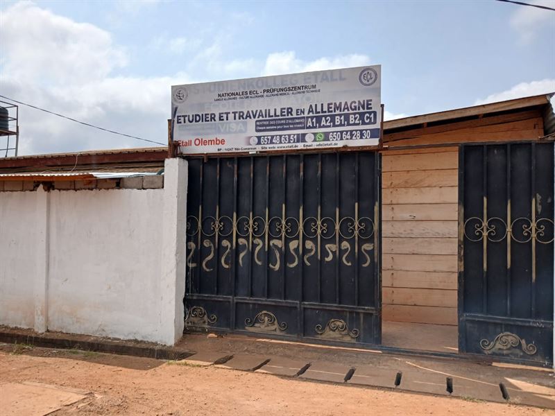 Sign and gate of the ETALL Olembé centre in Yaoundé