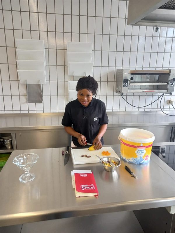 An ETALL student in a professional kitchen during training in Germany